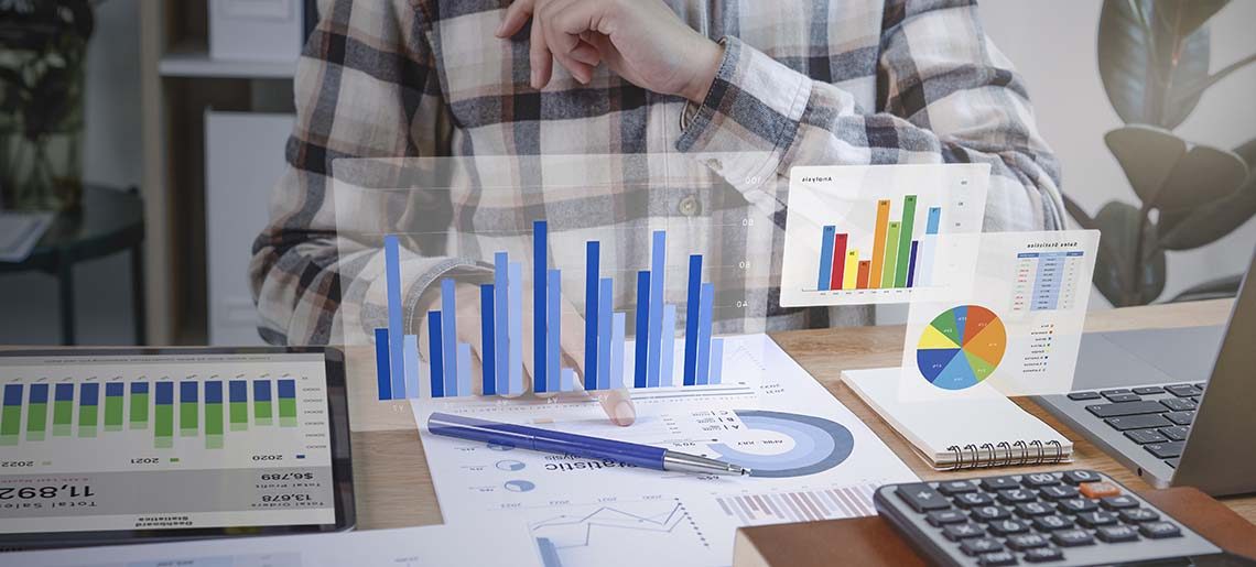 Businesspeople working in finance and accounting Analyze financial graph budget and planning for future in office room.